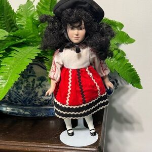 Red and Black Doll with Curly Hair
